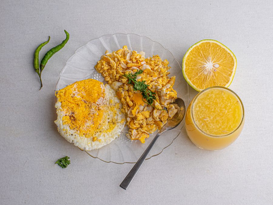 Fluffy scrambled egg clumps with chives